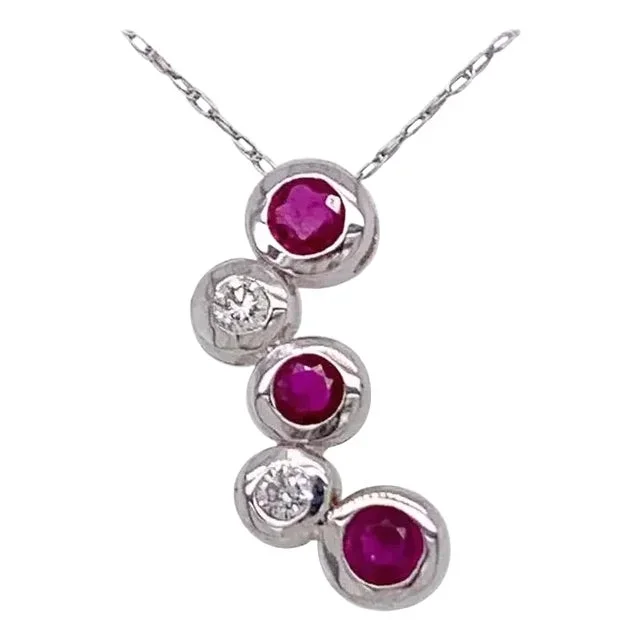 14kt Gold Ruby and Diamond Necklace Having 3 Rubies and 2 Round Diamonds
