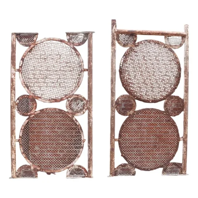 A Large Pair of Iron Panels With Circle Motif, C. 1940.