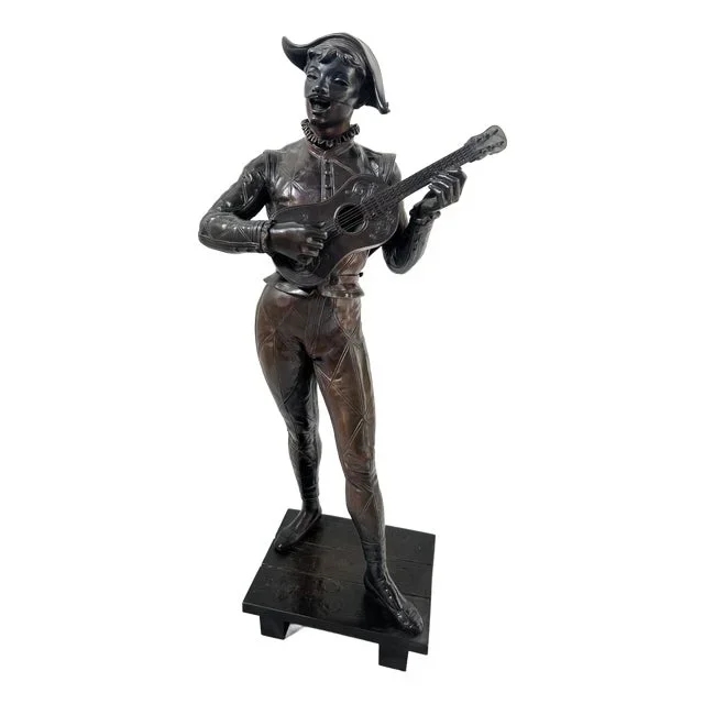 Bronze Harlequin Playing the Guitar by Debut Marcel