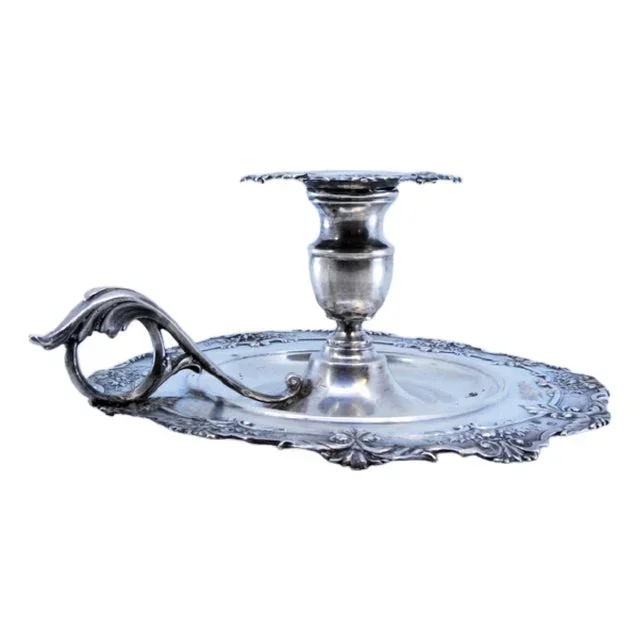Silver Paddle with Embossed Floral Motifs